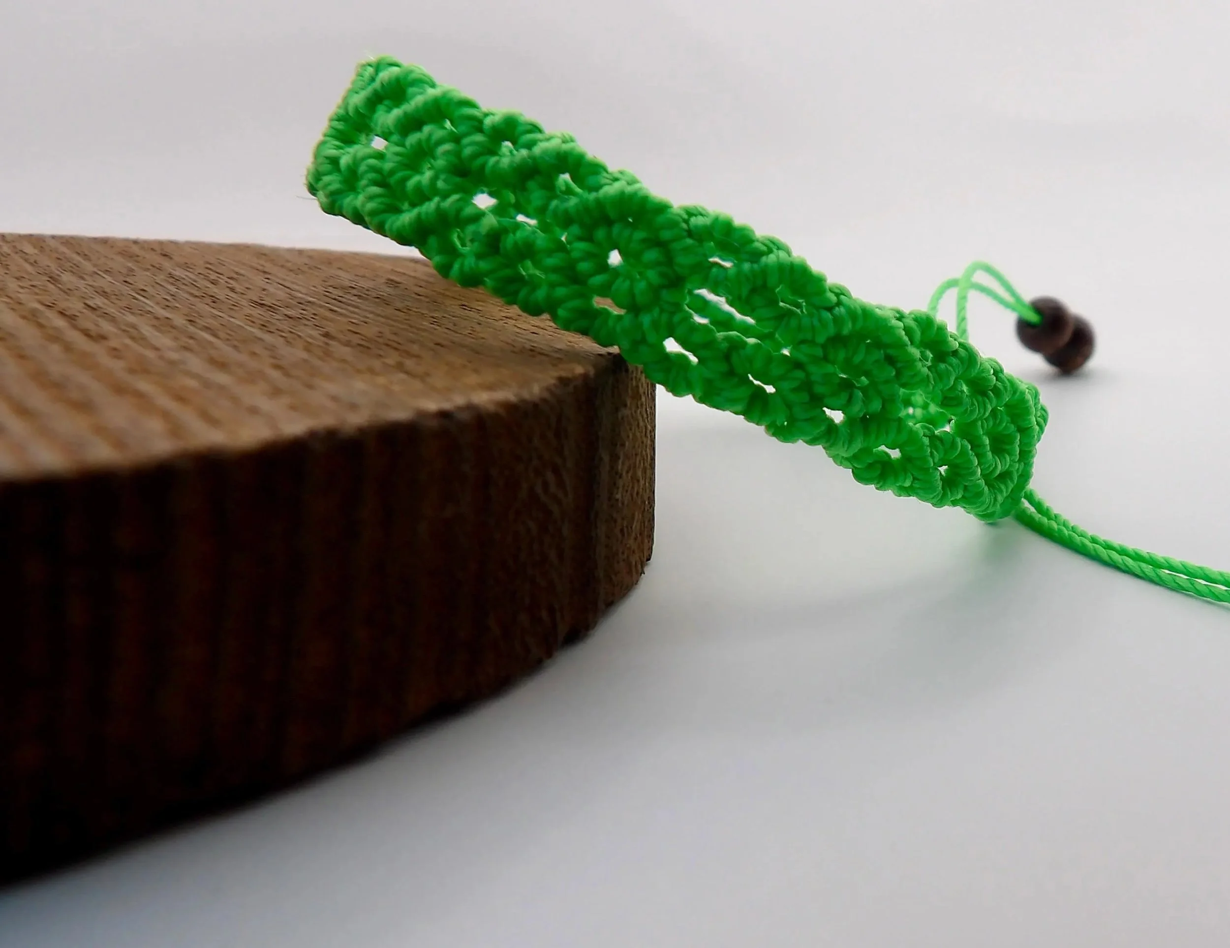 architectural infinity weave bracelet handmade in pearland texas, blending technical fiber art with organic materials.