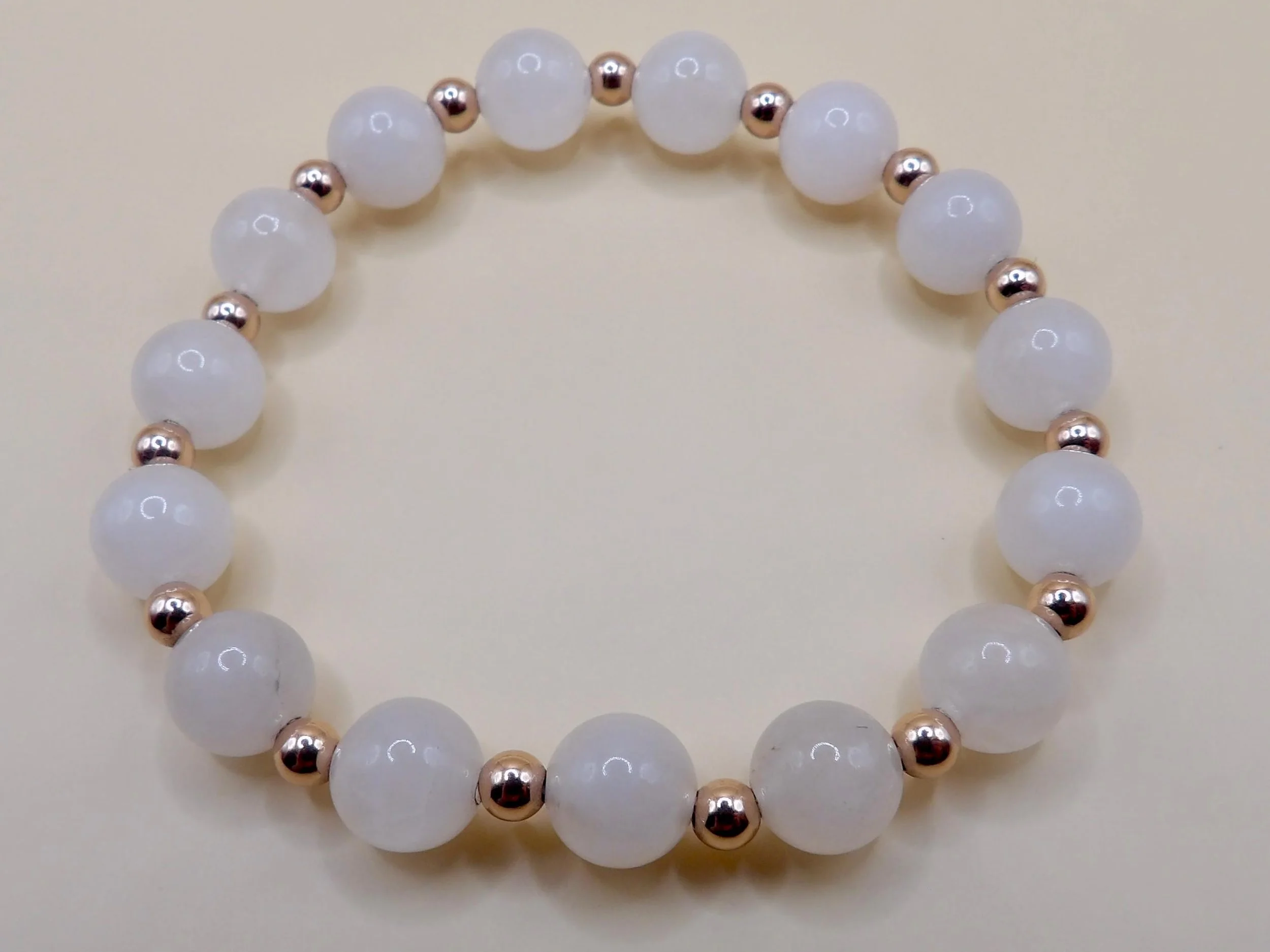 detailed view of the 14k rose gold filled beads and the polished finish of the natural quartz stones.