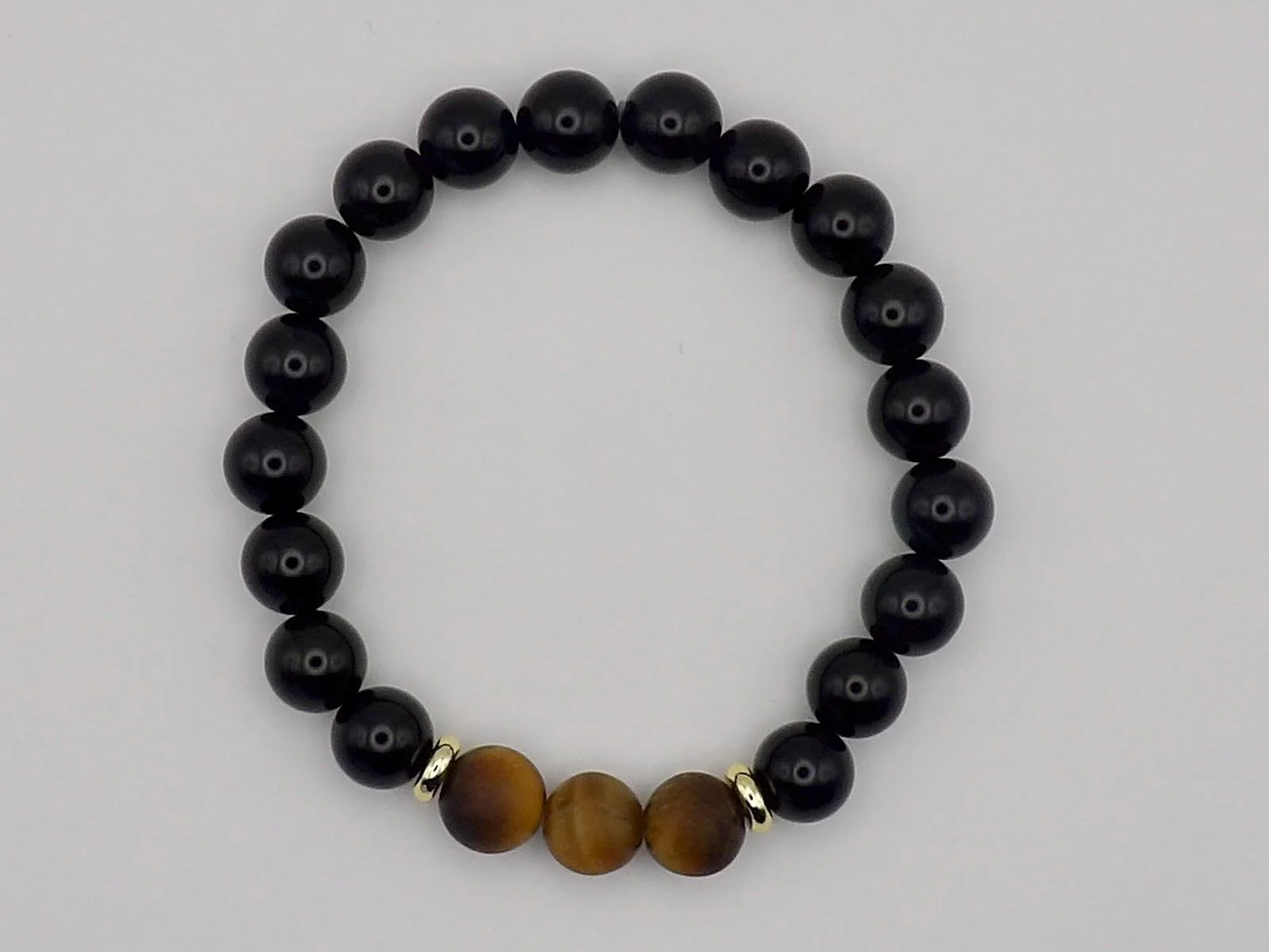 an intentional jewelry design for professionals, featuring durable construction and premium "stoic" gemstones.
