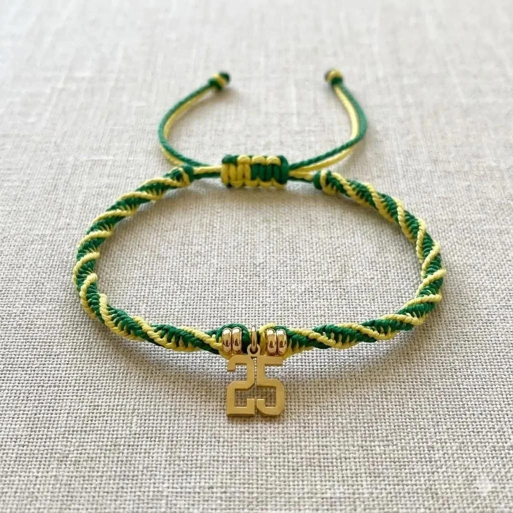 the proud grad stack styled in a "commencement-chic" aesthetic, emphasizing its high-end materials and sentimental value.