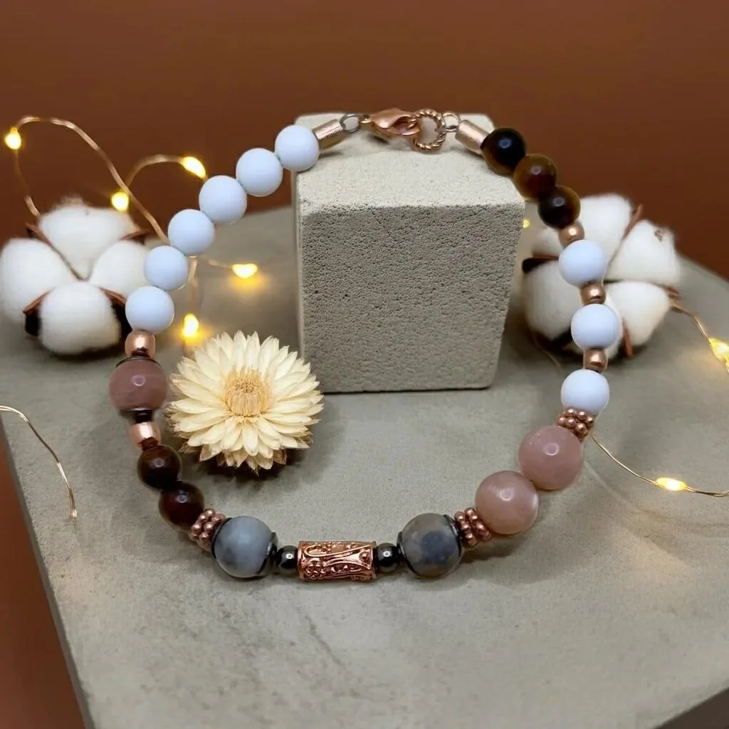close-up of the free spirit bracelet highlighting the unique natural patterns in the jade and sunstone with rose gold hardware.