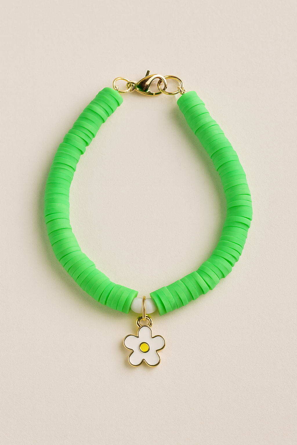 the sunny daisy bracelet | green heishi beads + crystal accents | gold finish daisy charm