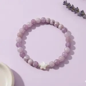 Handmade lavender jade gemstone bracelet featuring iridescent mother of pearl star beads and silver accents.