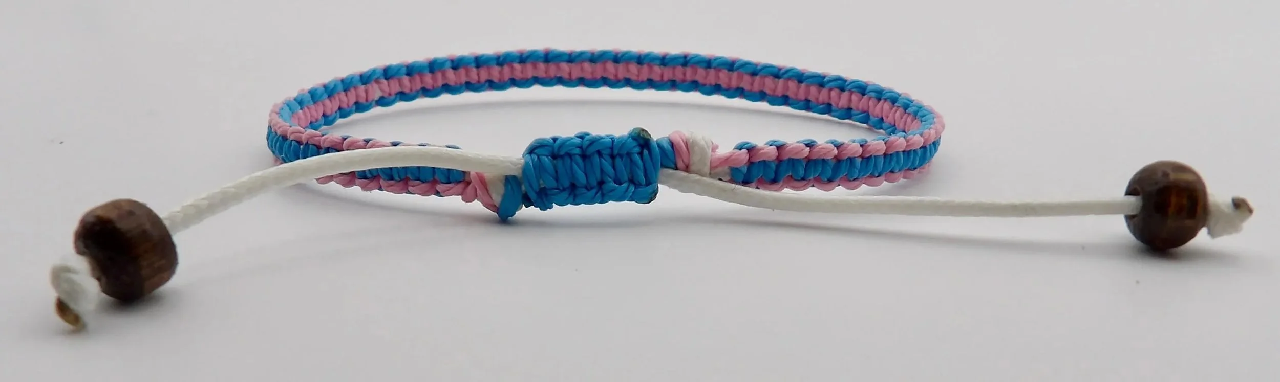 Waterproof custom color woven bracelet with natural wood beads, ideal for active lifestyles and outdoor wear.
