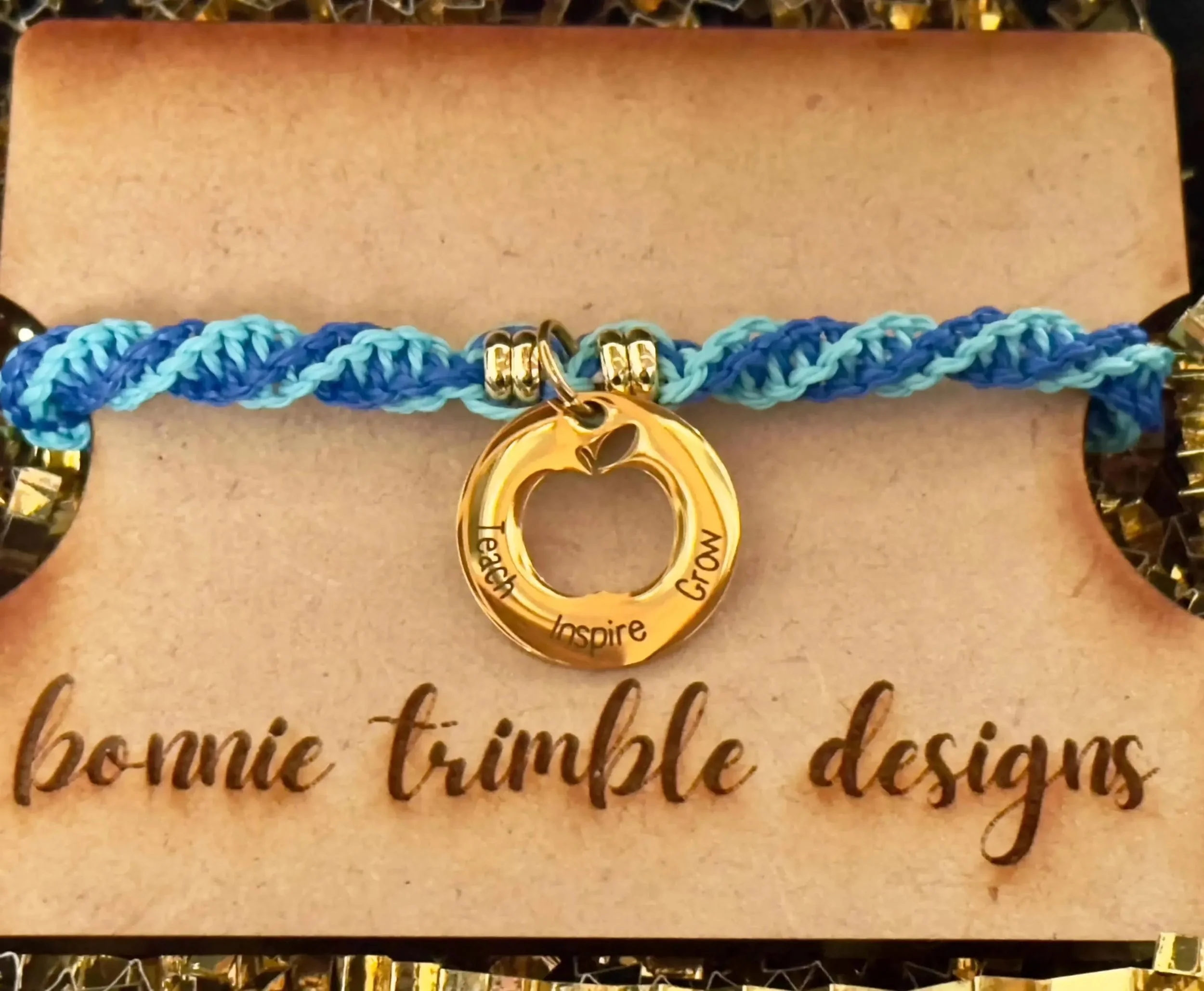 the golden mentor bracelet styled on a velvet jewelry tray to emphasize its 18k gold plated professional aesthetic.