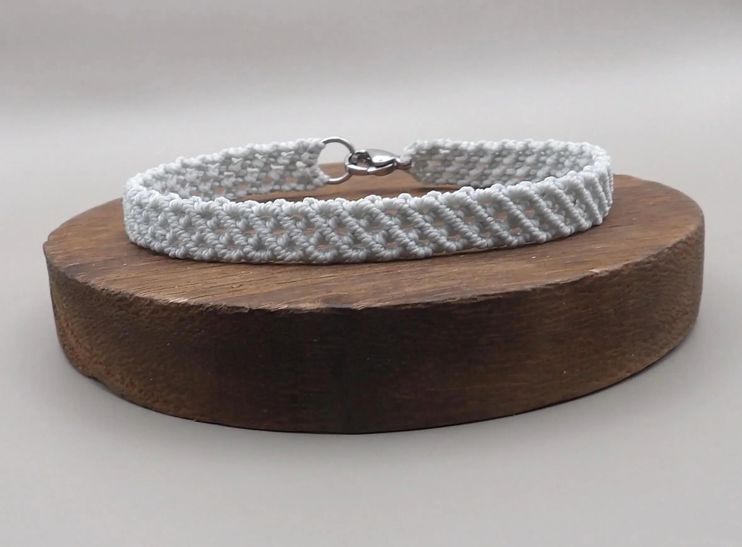 the gray layers bracelet styled for an "executive armor" look, emphasizing its clean lines and high-performance materials.