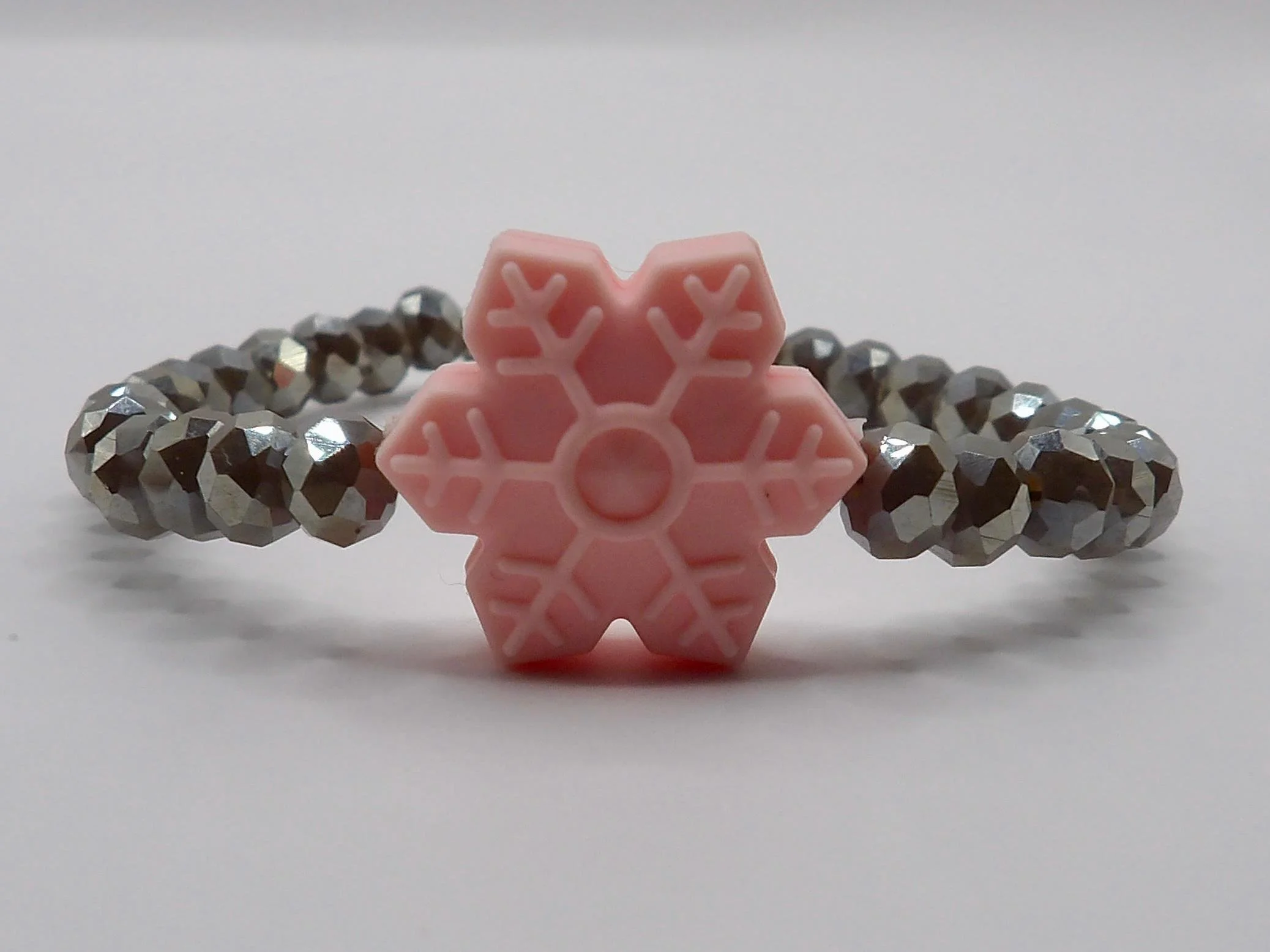 a festive stacking bracelet designed to bring a touch of winter magic to any daily wardrobe.