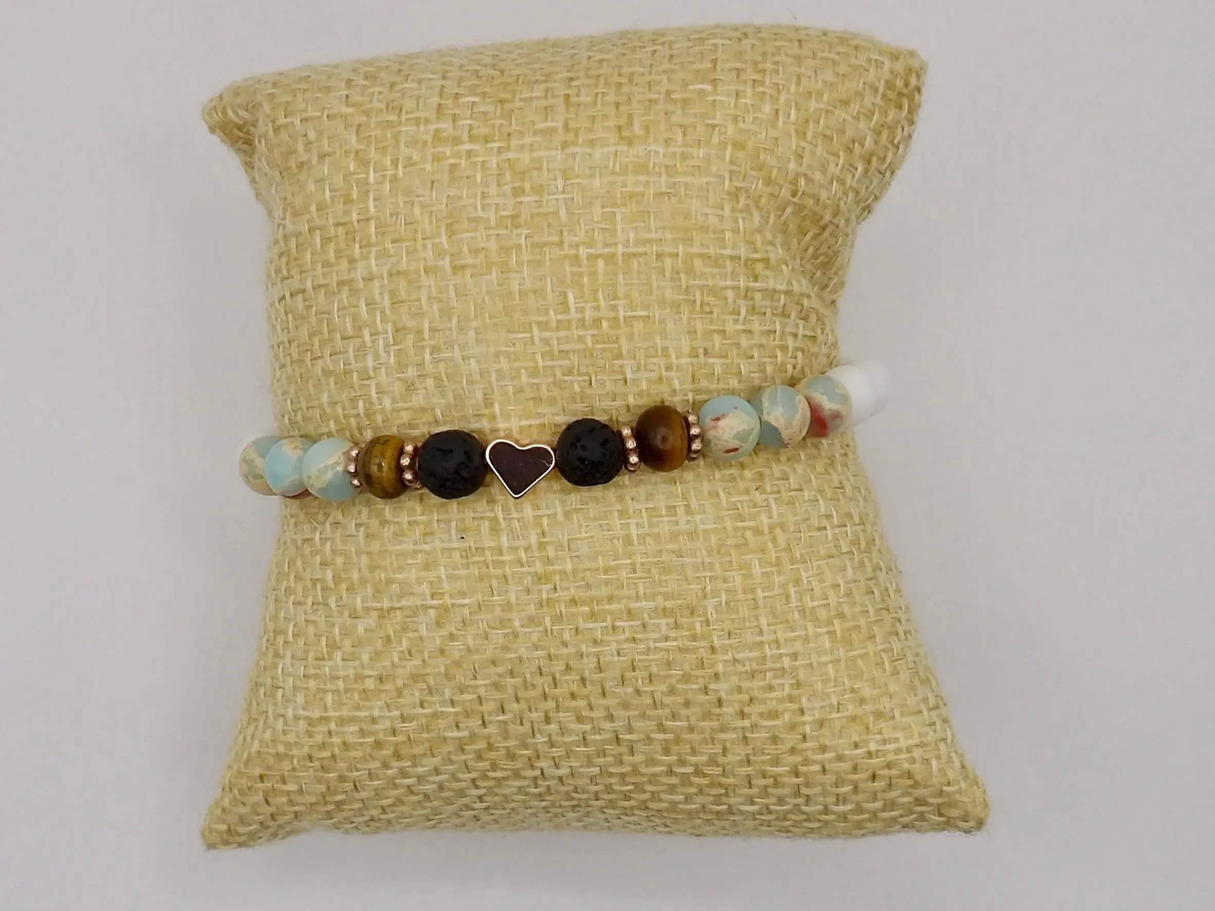 handcrafted aromatherapy jewelry designed to diffuse essential oils on lava beads, accented with rose gold and mixed minerals.