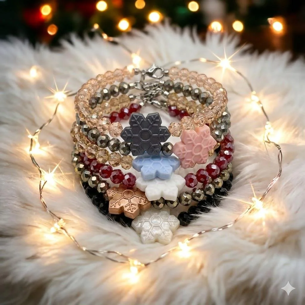 the winter sparkle bracelet featuring shimmering faceted glass beads and a soft, durable silicone snowflake focal.