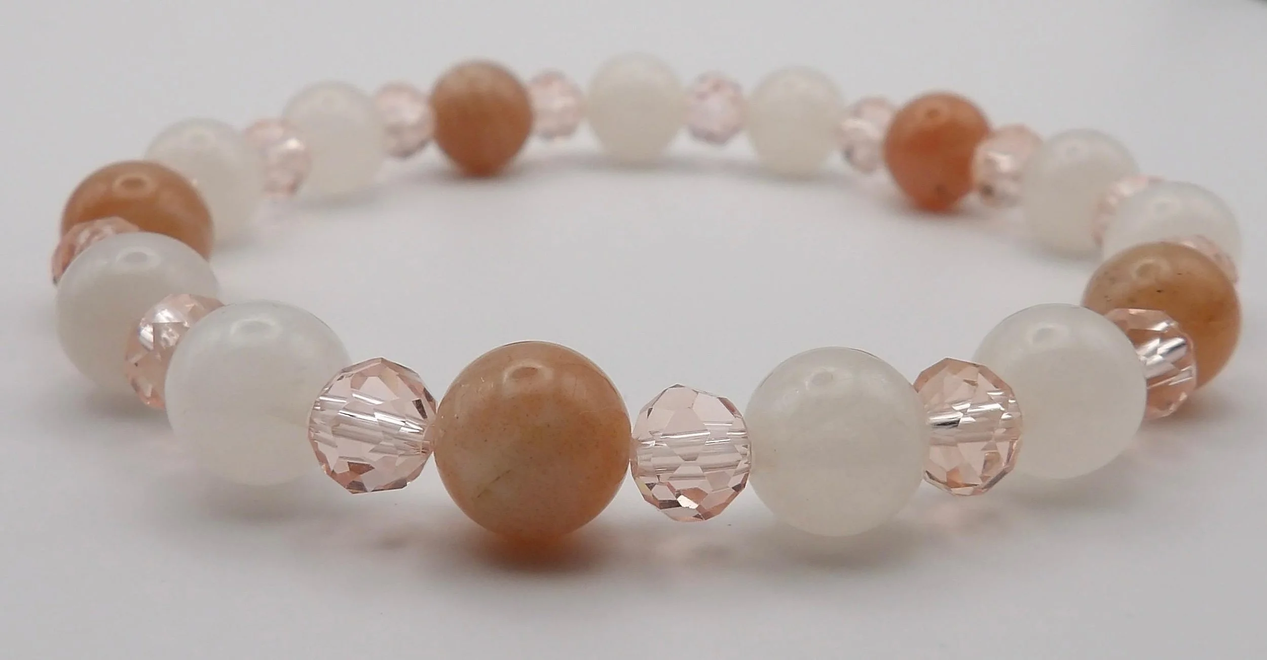 the balanced duo set styled as a sentimental gift, emphasizing its soft "nurture-core" palette and high-quality stones.