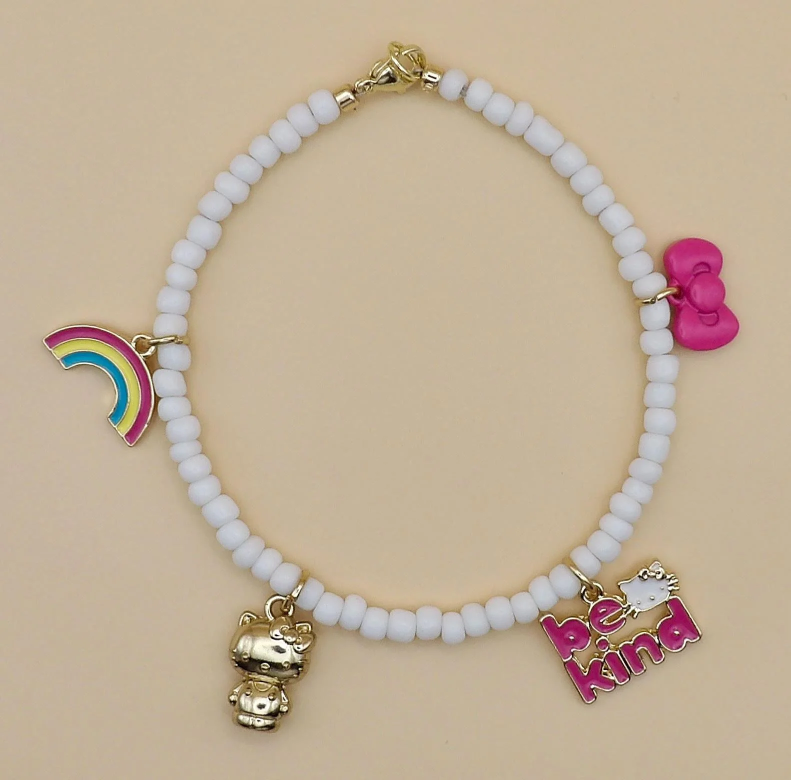handcrafted 18k gold-plated hello kitty jewelry with tiny white seed beads for a clean, playful, and elevated aesthetic.