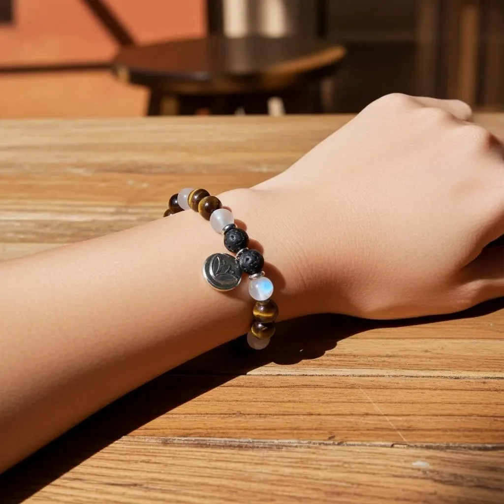 close-up of the creative spirit bracelet highlighting the chatoyancy of tiger's eye and the dark, textured surface of lava rock beads.