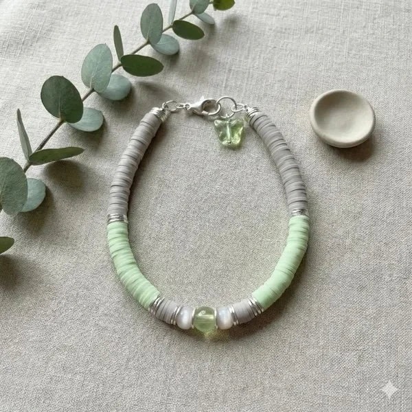 bright lime green heishi bead bracelet featuring a butterfly charm.