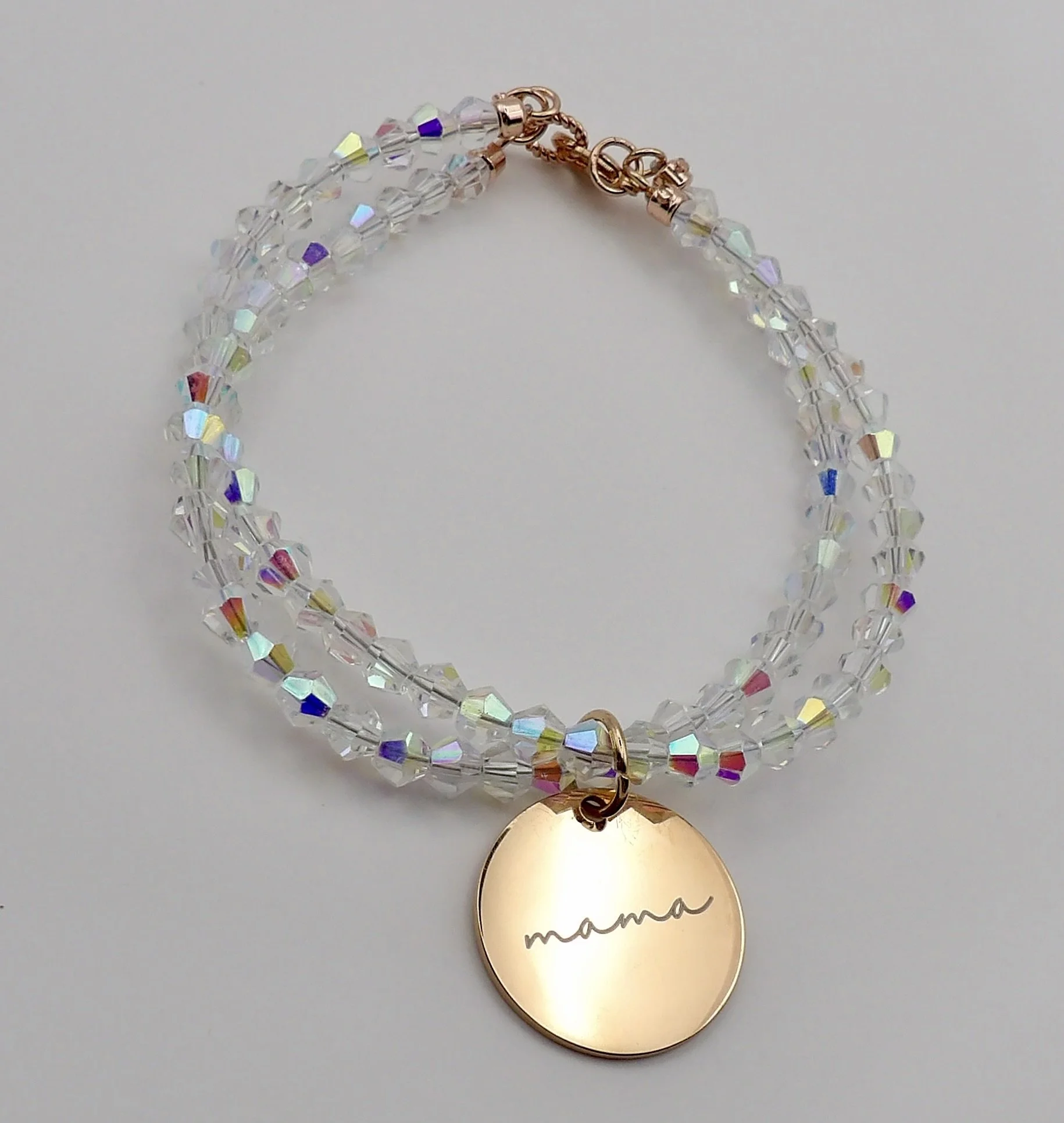 handmade 14k rose gold mama charm bracelet featuring a double crossover band of sparkling ab white crystal beads.
