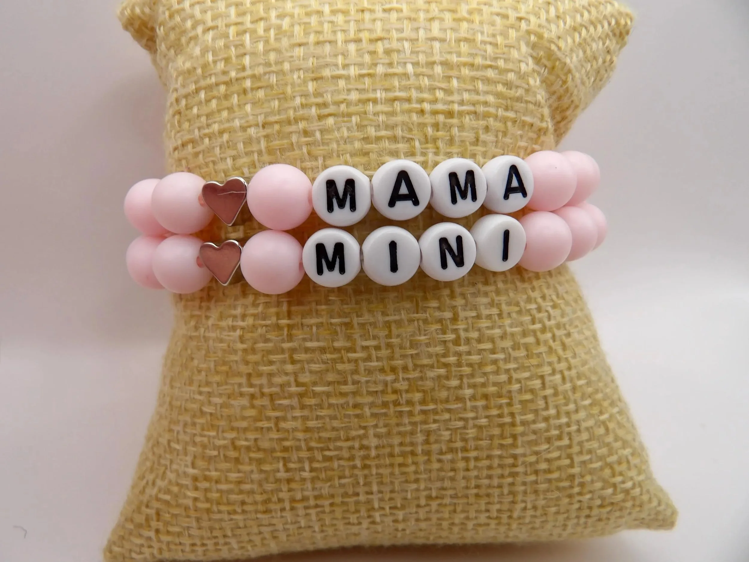 the mama and mini matching hearts set styled for a family photoshoot, emphasizing the delicate powder pink color story.