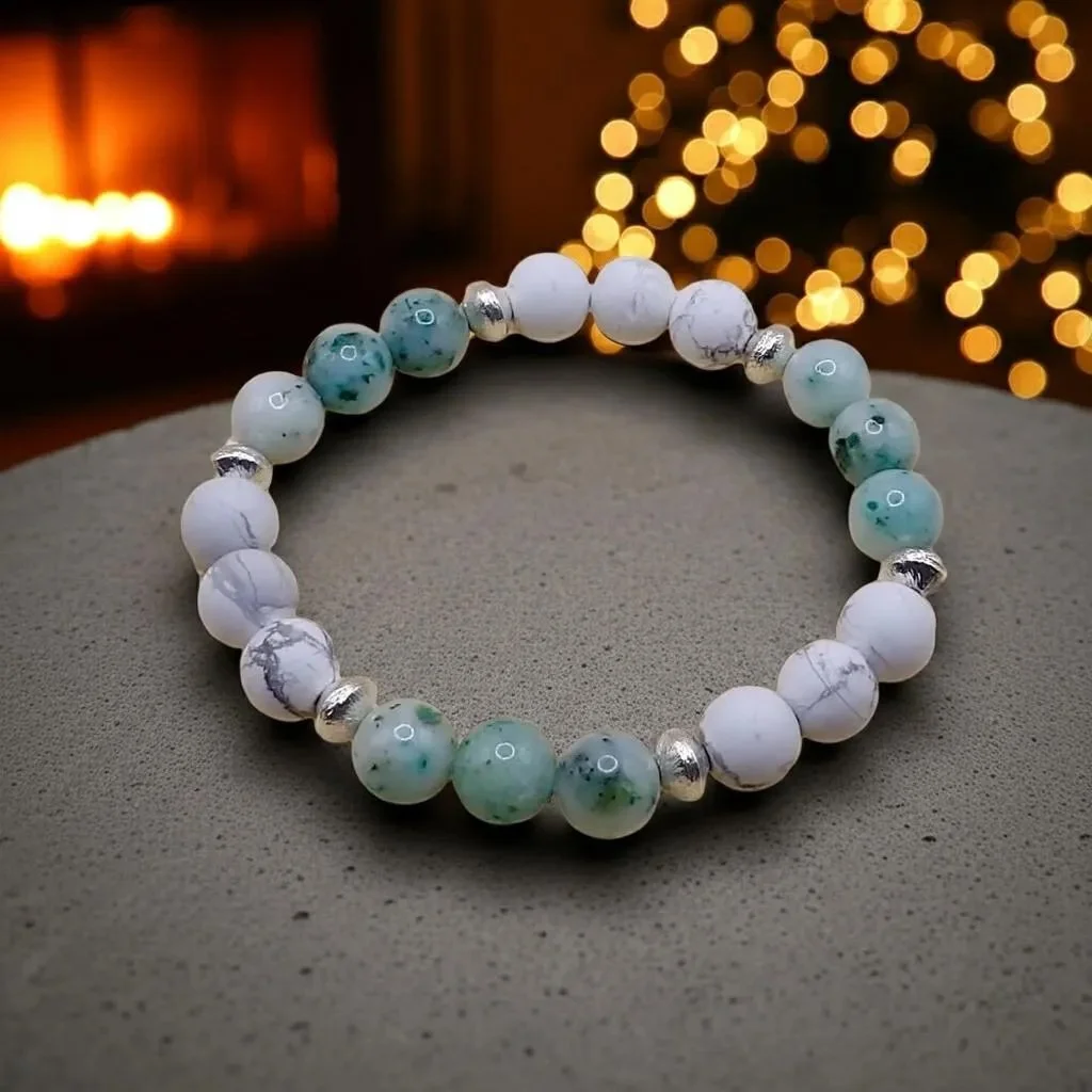 a minimalist gemstone bracelet showing the soft marble texture of howlite paired with the organic earthy tones of chrysocolla.