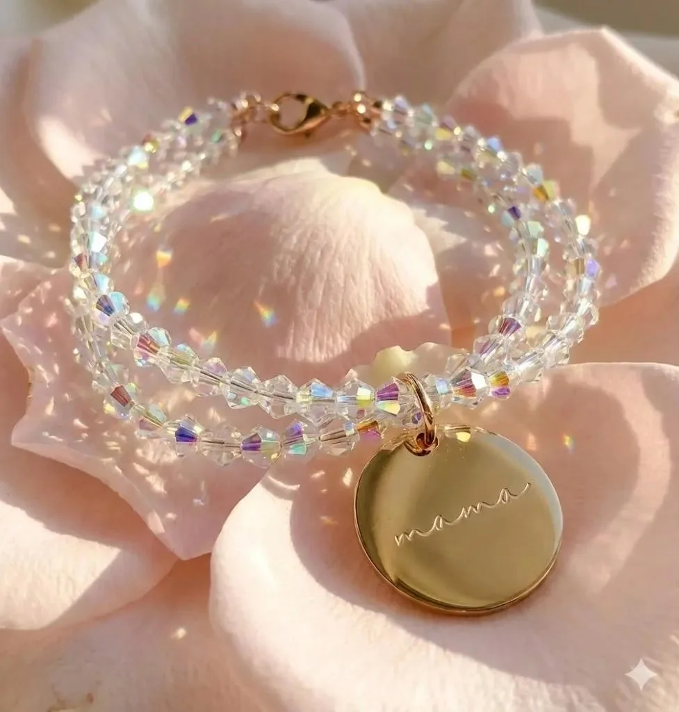 rose gold "mama" charm bracelet with a double-layered look of clear aurora borealis crystal beads on a stretch cord.