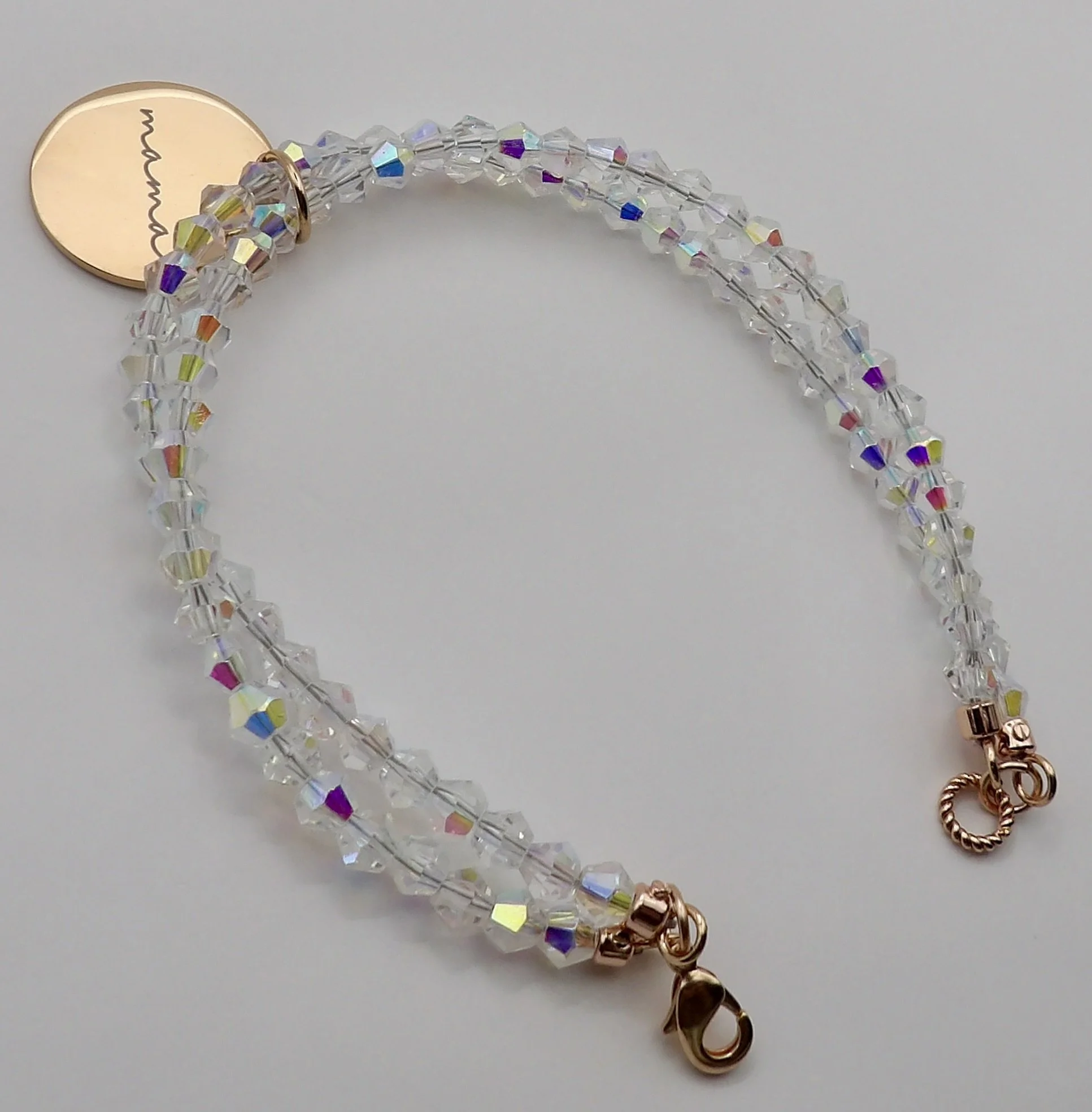 view of the secure 14k solid rose gold lobster clasp and twisted jump ring on the handmade crystal beaded bracelet.