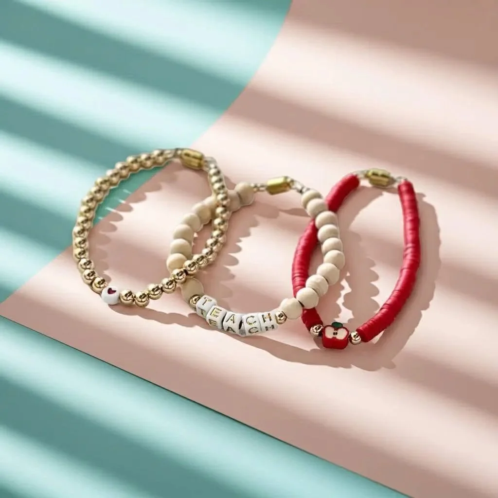 close-up of a high-shine 18k gold magnetic bracelet stack showing the luxury finish and ease of the magnetic jewelry connection.