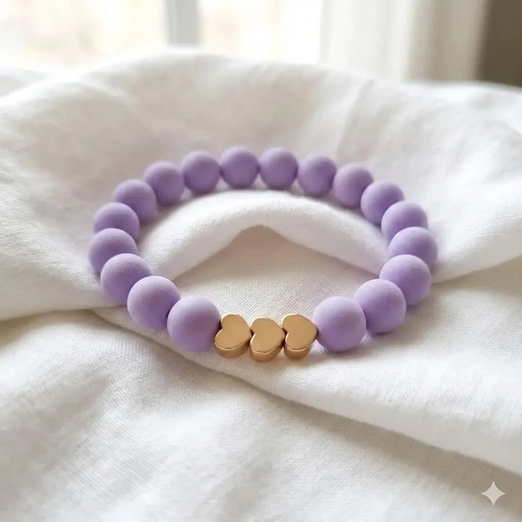 close-up of the matte heart beads highlighting the smooth finish and the rhythmic pop of the metallic accents.