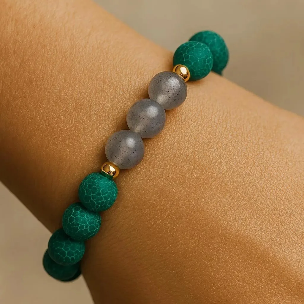 a sophisticated gemstone bracelet showing the deep forest green of matte agate paired with the blue flashes of natural labradorite.