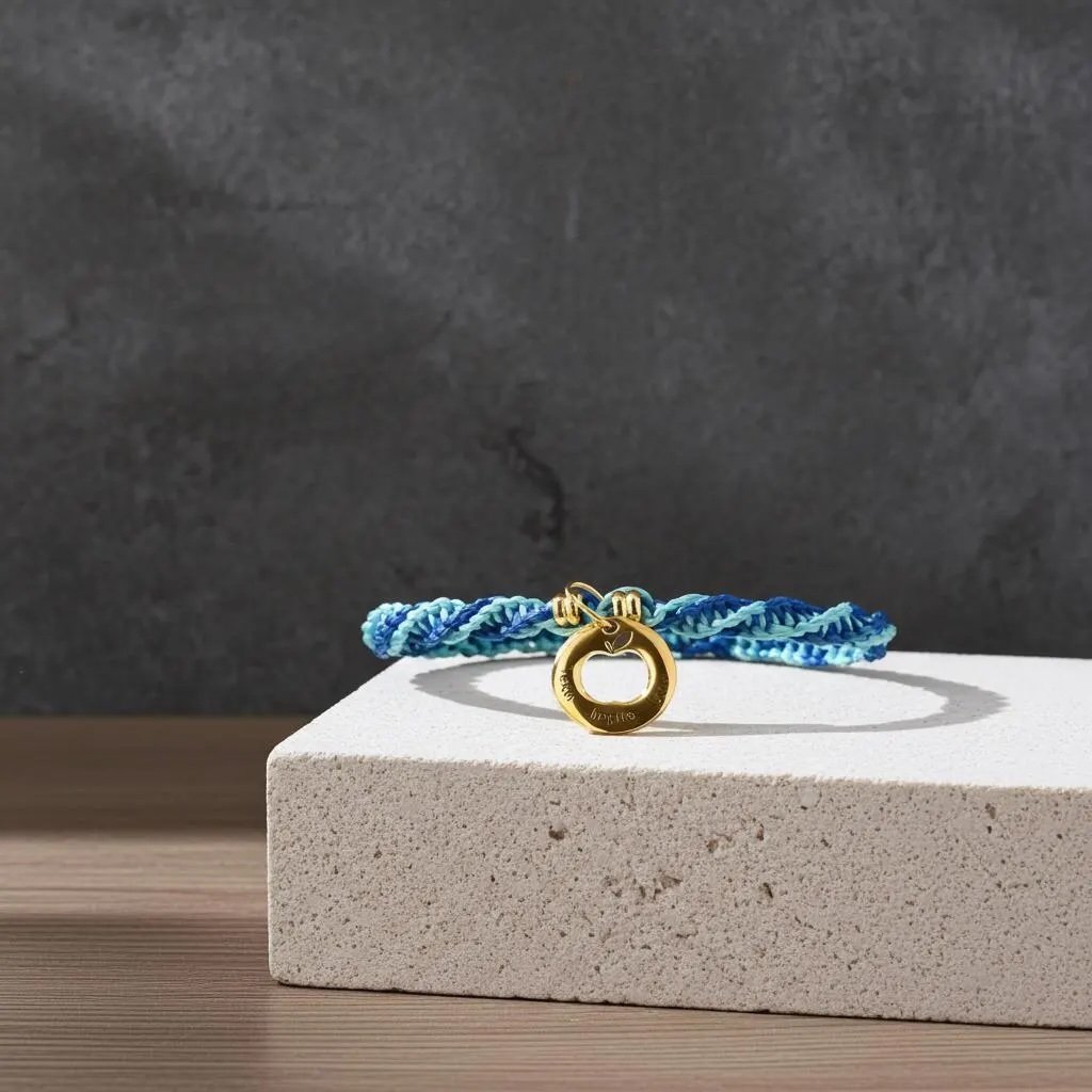 a personalized gold and macramé anchor bracelet designed as a meaningful thank-you gift for teachers and mentors.