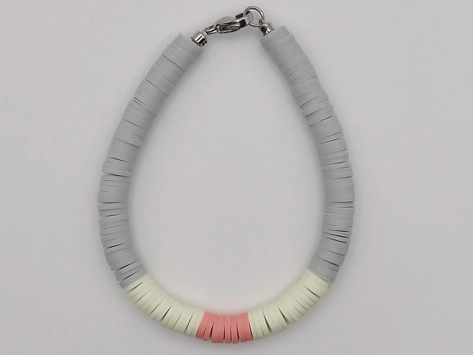 close-up of the modern curator bracelet highlighting the matte clay texture and the high-shine industrial metal clasp.