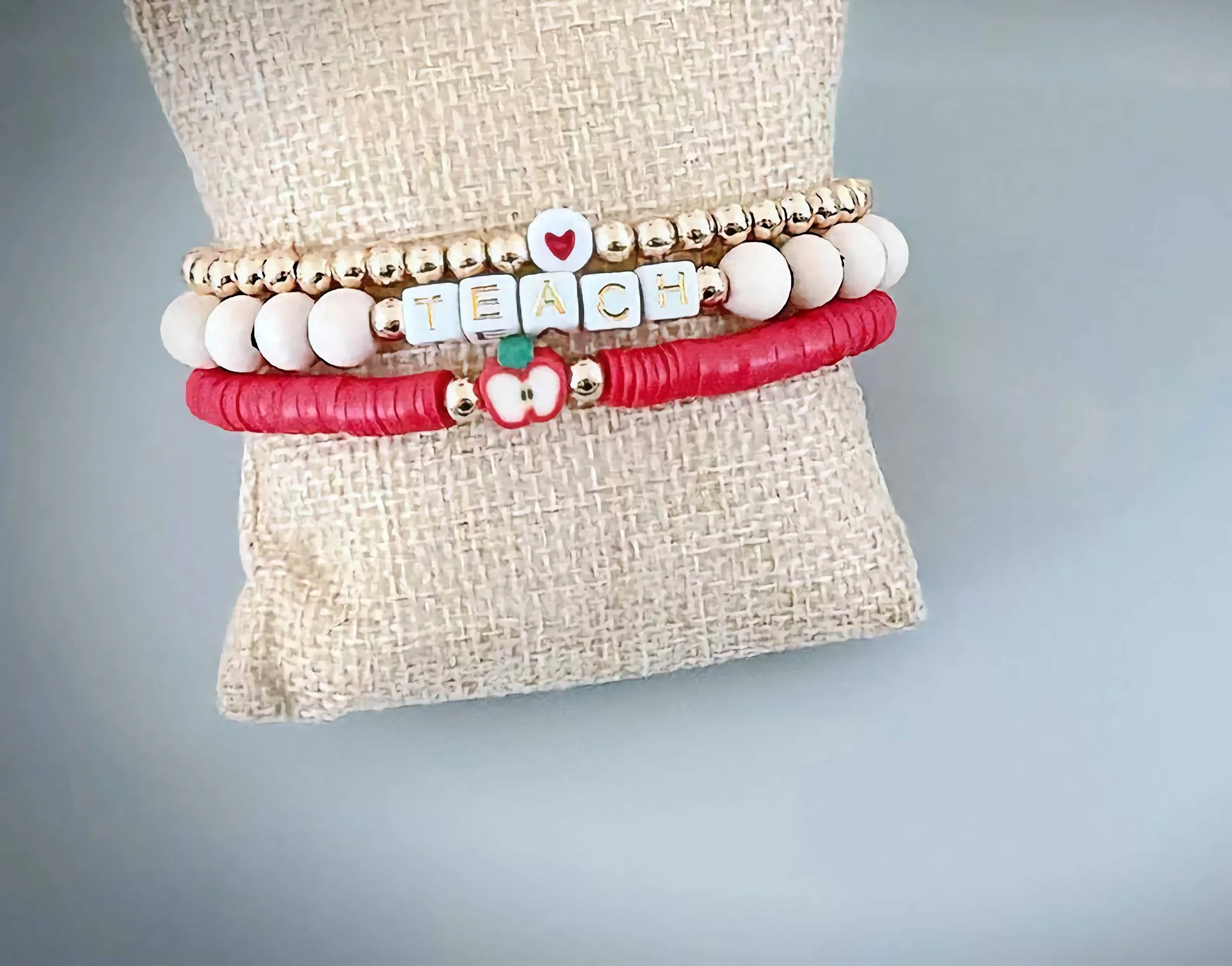 handmade gold & red “teach” stacked bracelets-5mm -edited.png