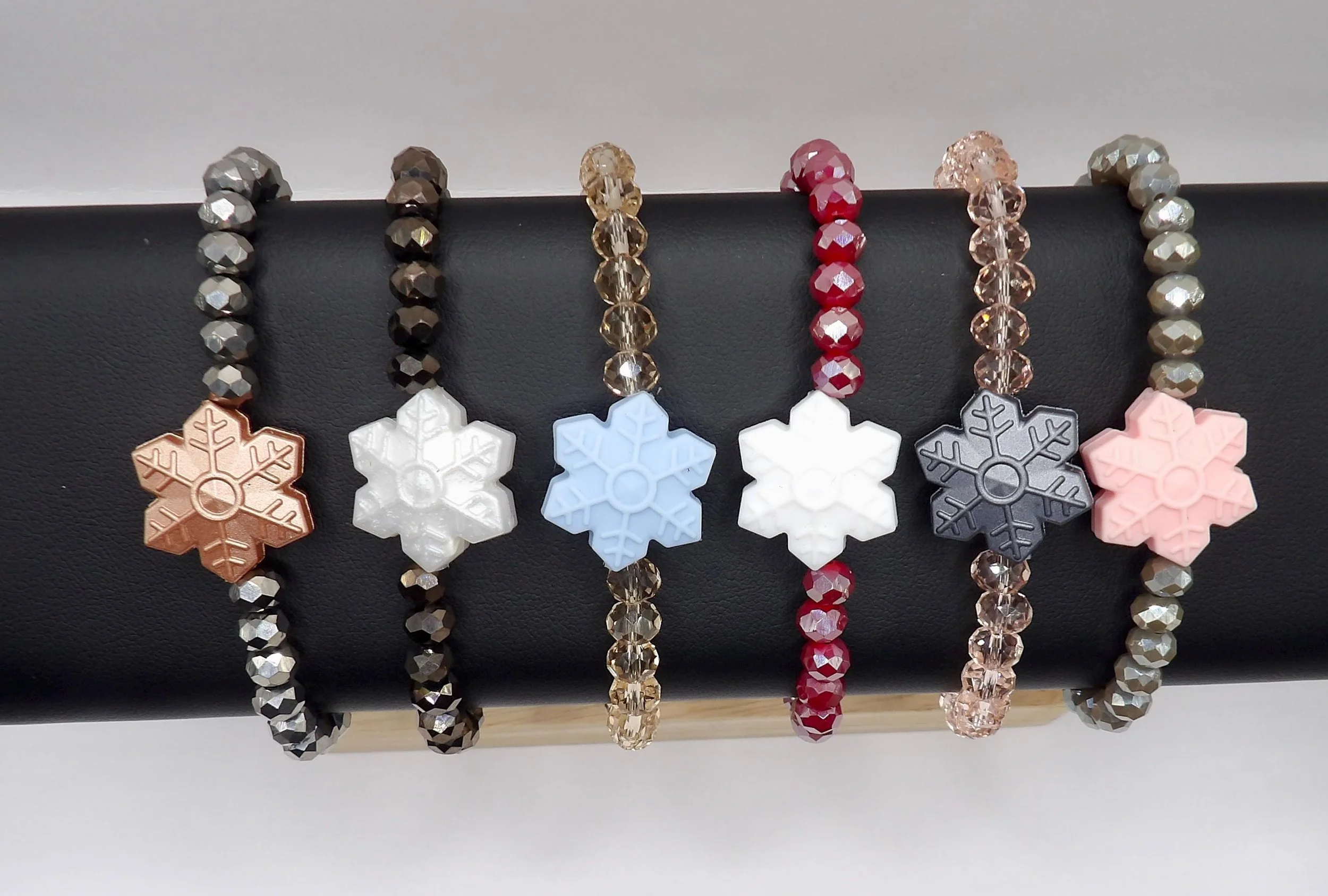a dainty yet statement-making winter bracelet with a soft silicone snowflake that is perfect for all-day wear.
