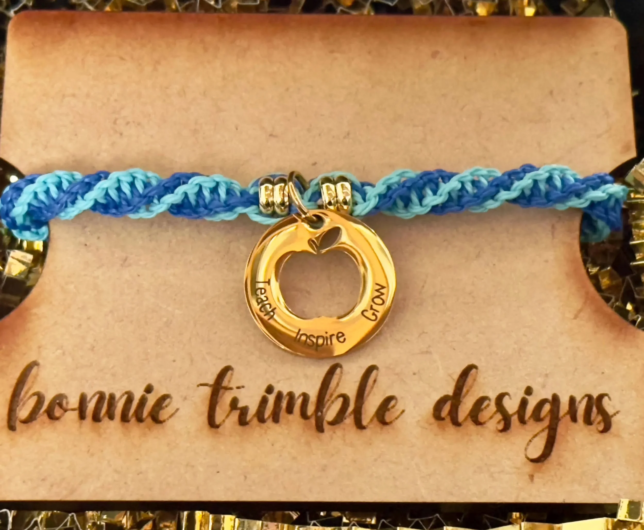 handmade gold & 2-color (light and dark blue), w/ “teach inspire grow” charm twisted macrame bracelet