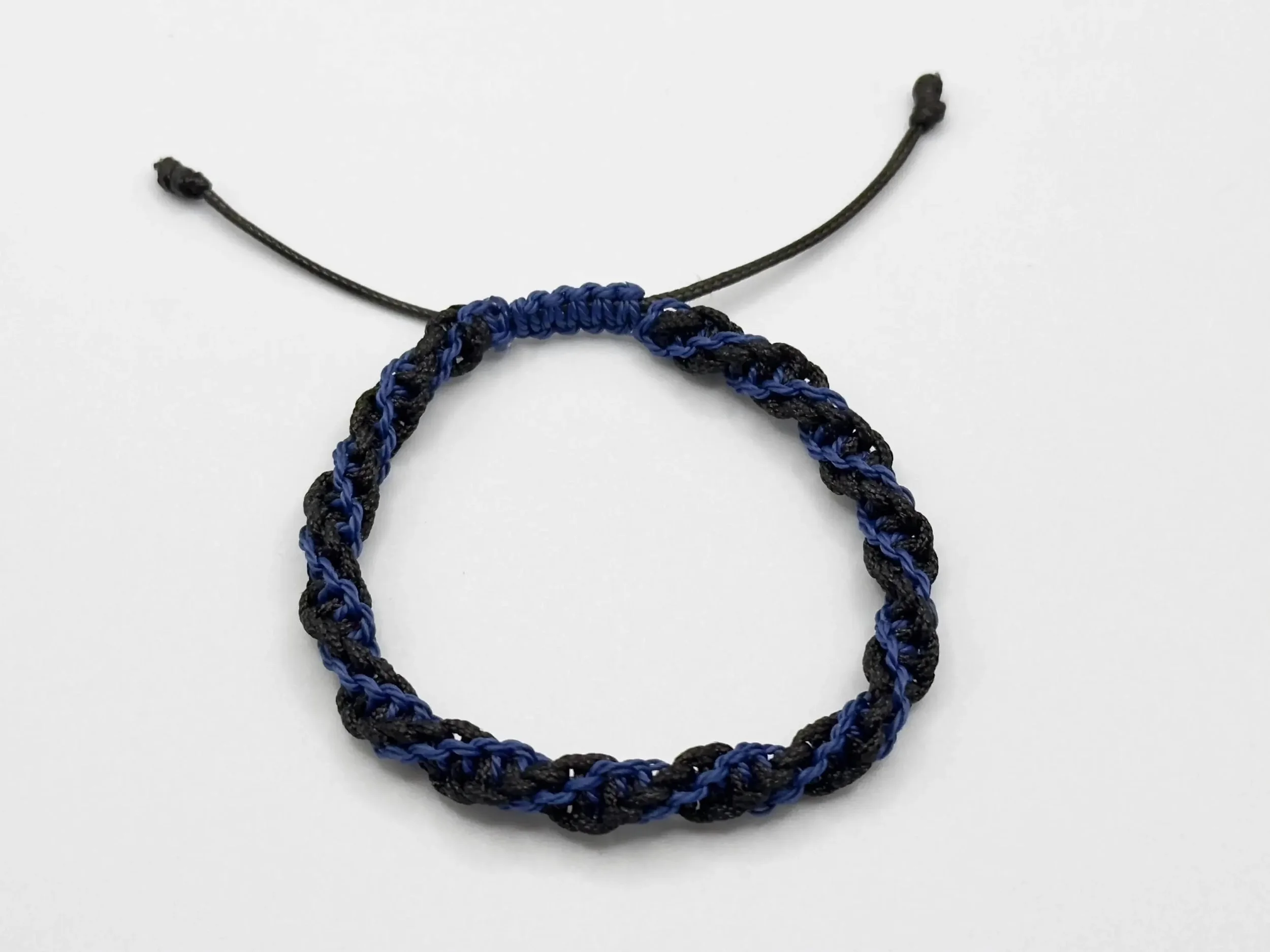 a minimalist stackable cord bracelet available in various custom colors to suit any active wardrobe.