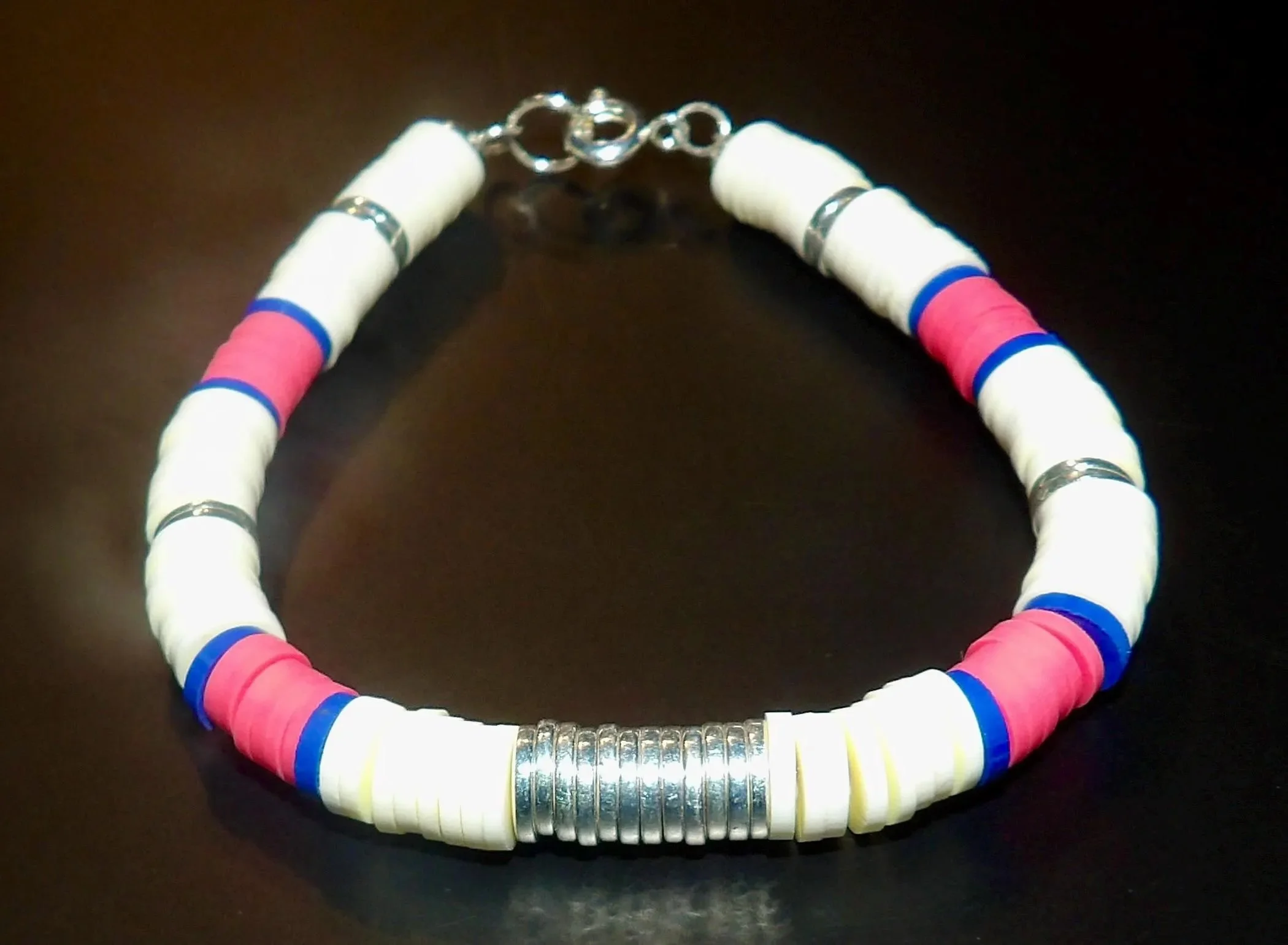 handcrafted hot pink and navy school spirit jewelry with silver hematite stones on a durable stretch cord for daily wear.