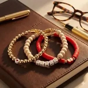 professional gold bead stack for teachers with a magnetic closure and "teach" message beads for an elevated look.