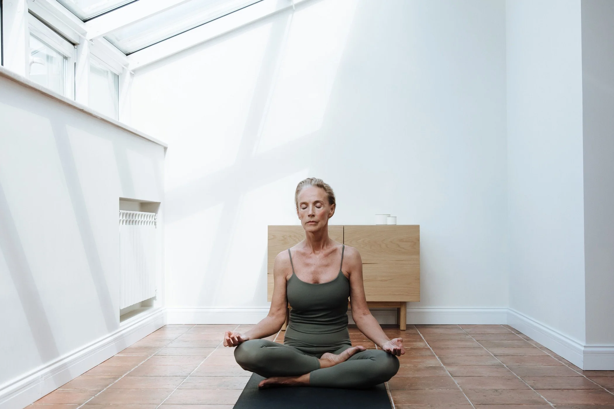 Woman practicing yoga, a natural way to support mental clarity during menopause