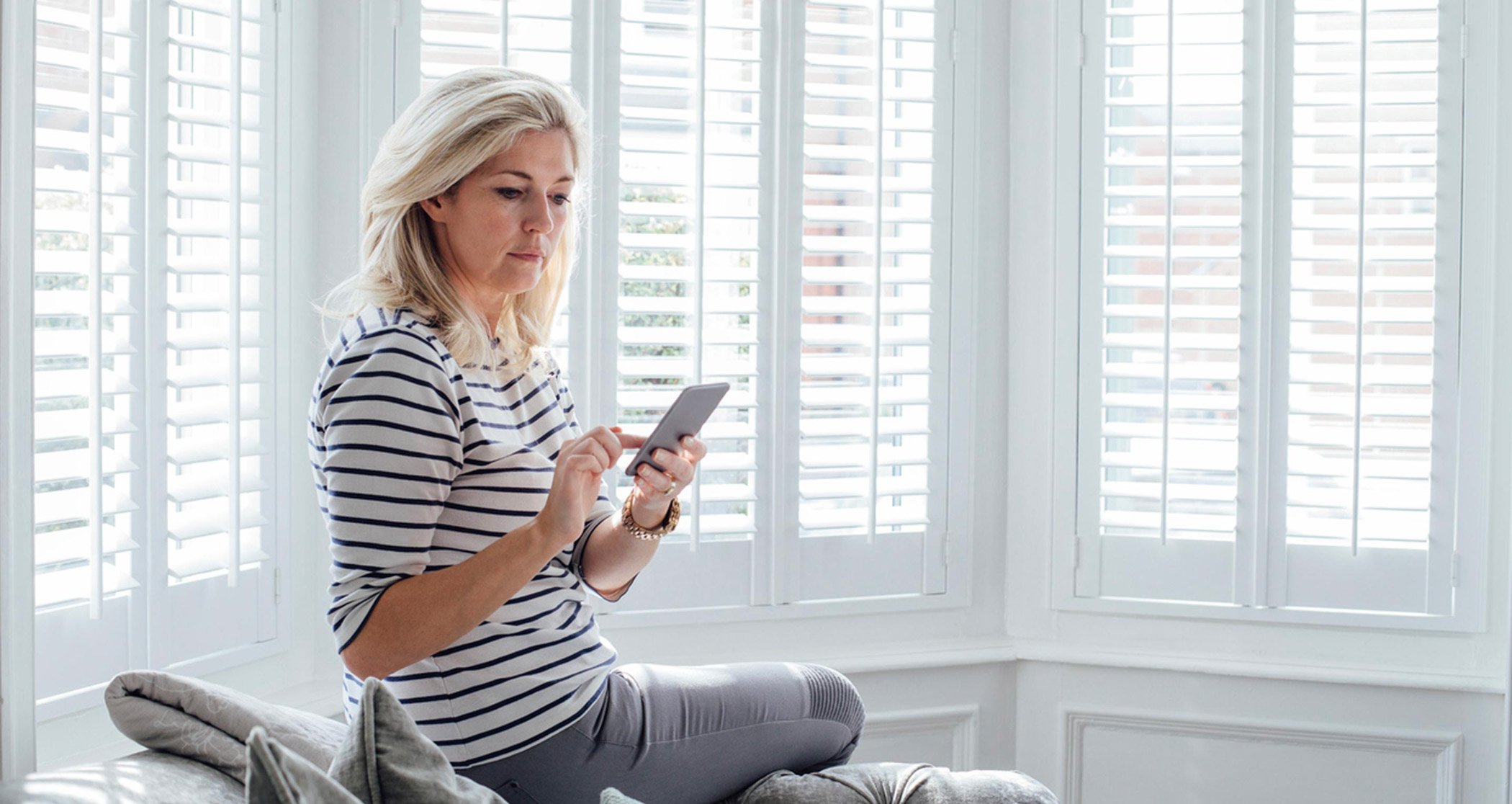 Woman in her 40s reviewing her cycle while considering birth control in perimenopause