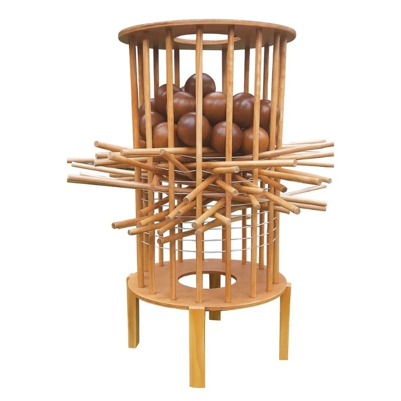 A wooden game station with a cage of brown balls at the top, surrounded by multiple wooden sticks for knocking or manipulating, and a round base with four legs.