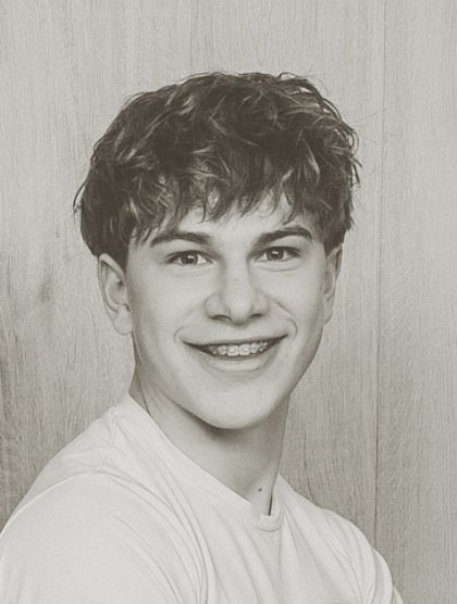 Julian worked closely with Mac Kandji. His coaching helped him build focus, discipline, and confidence on and off the field.