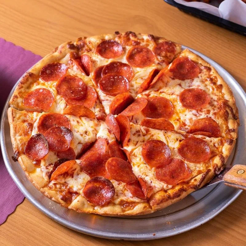 Pepperoni and sausage pizza on a metal tray