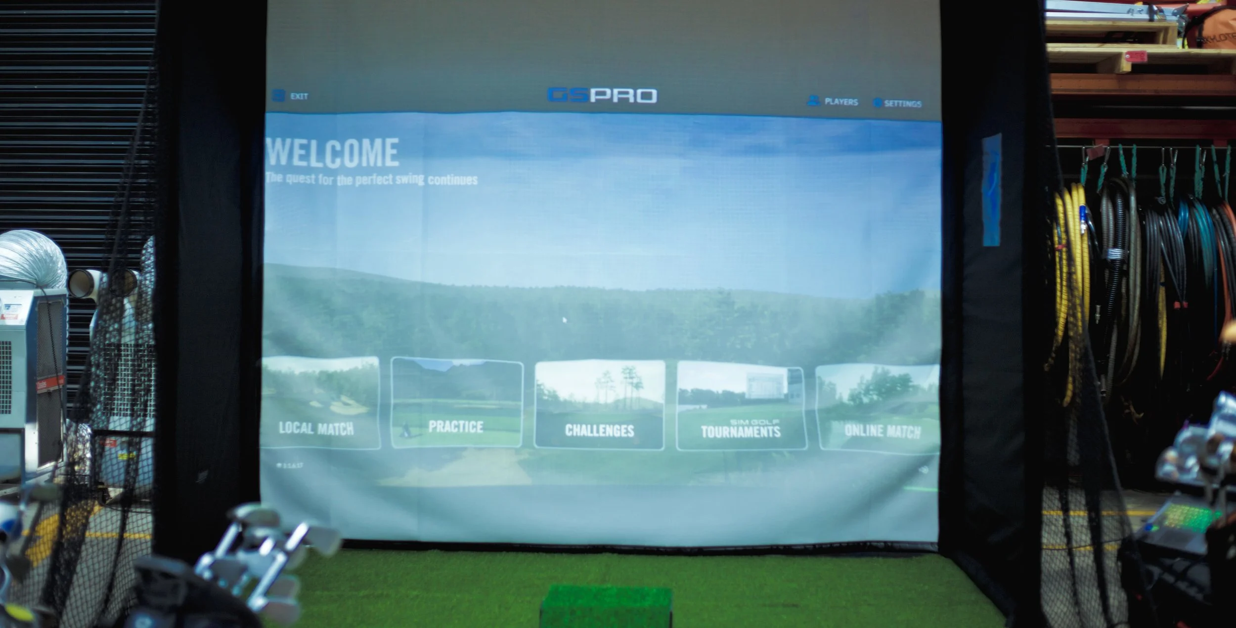 The Pop Up Golf welcome setup at a corporate event.