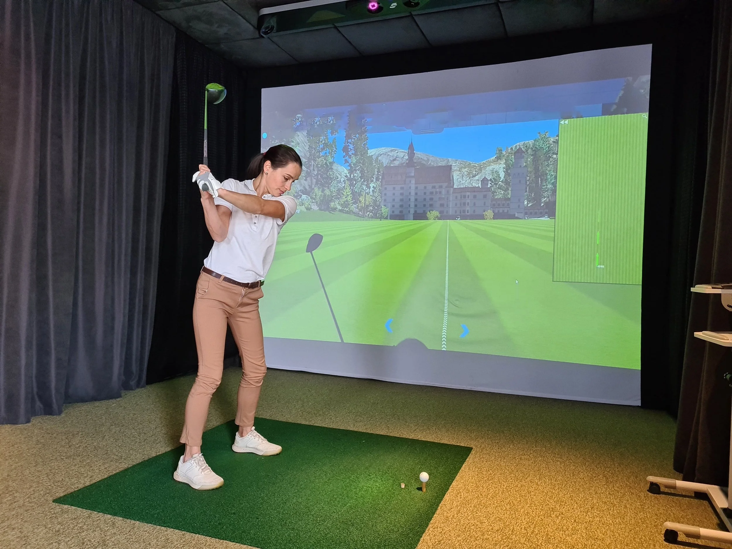 girl-playing-golf-simulator.jpg
