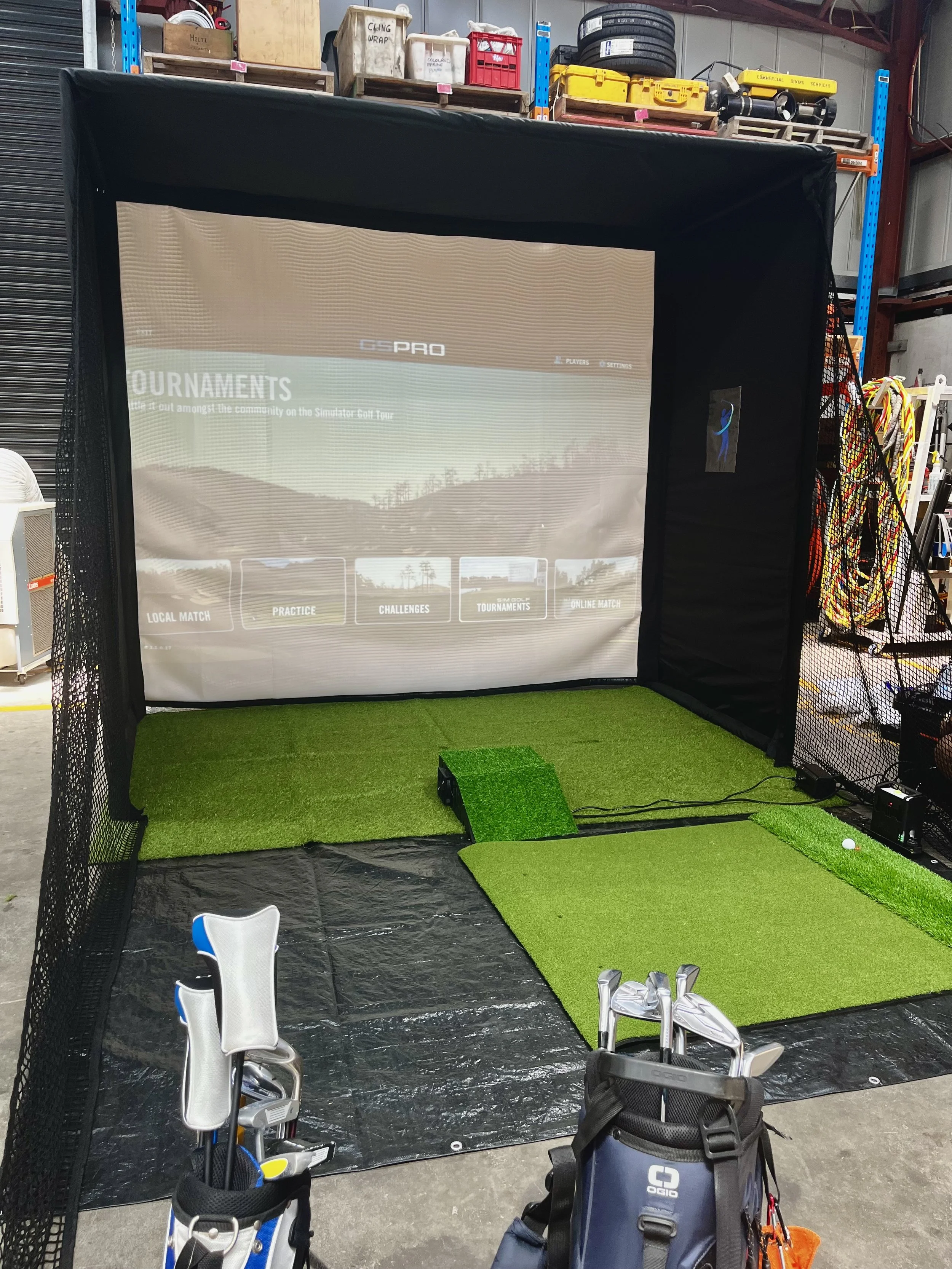 Mobile golf simulator hire in Wollongong with impact screen, launch monitor, and GSPro virtual golf setup