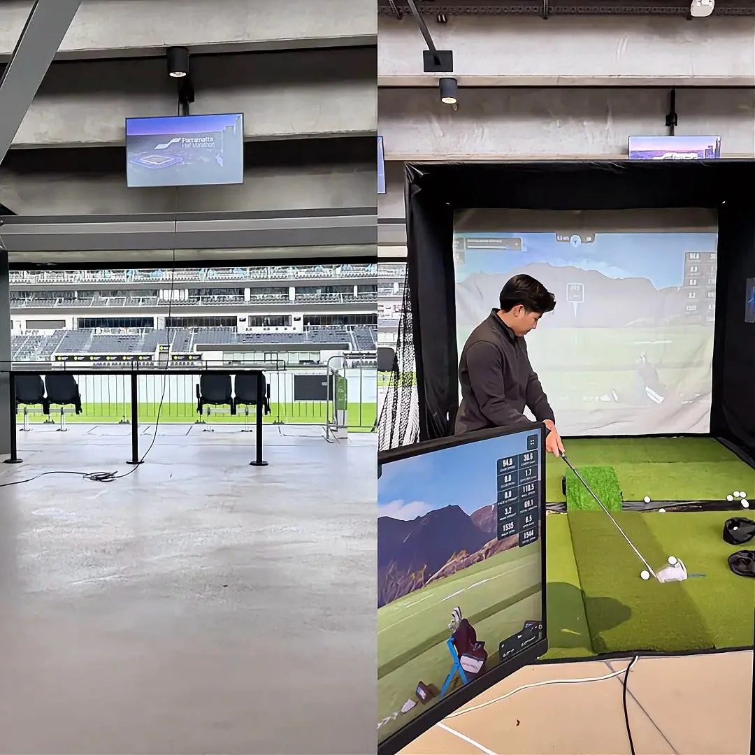 Mobile golf simulator enclosure set up inside an event space