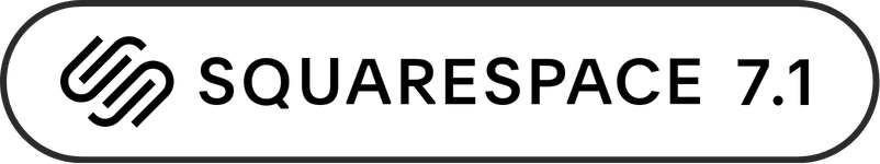 A close-up image of a black and white cat lying on a bed with pink and yellow blankets.