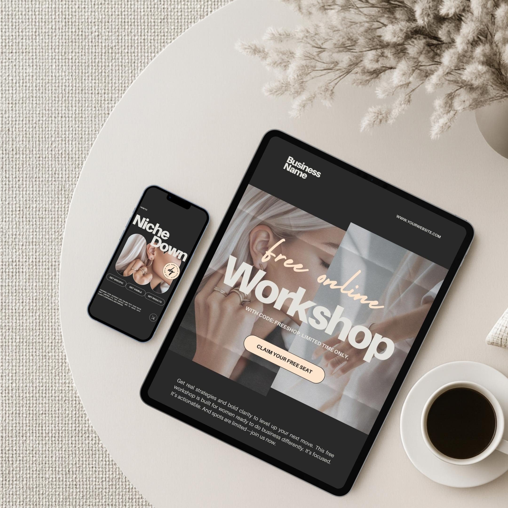 A tablet and smartphone on a white table showcasing online workshop advertisements, with a cup of coffee and a decorative plant nearby.