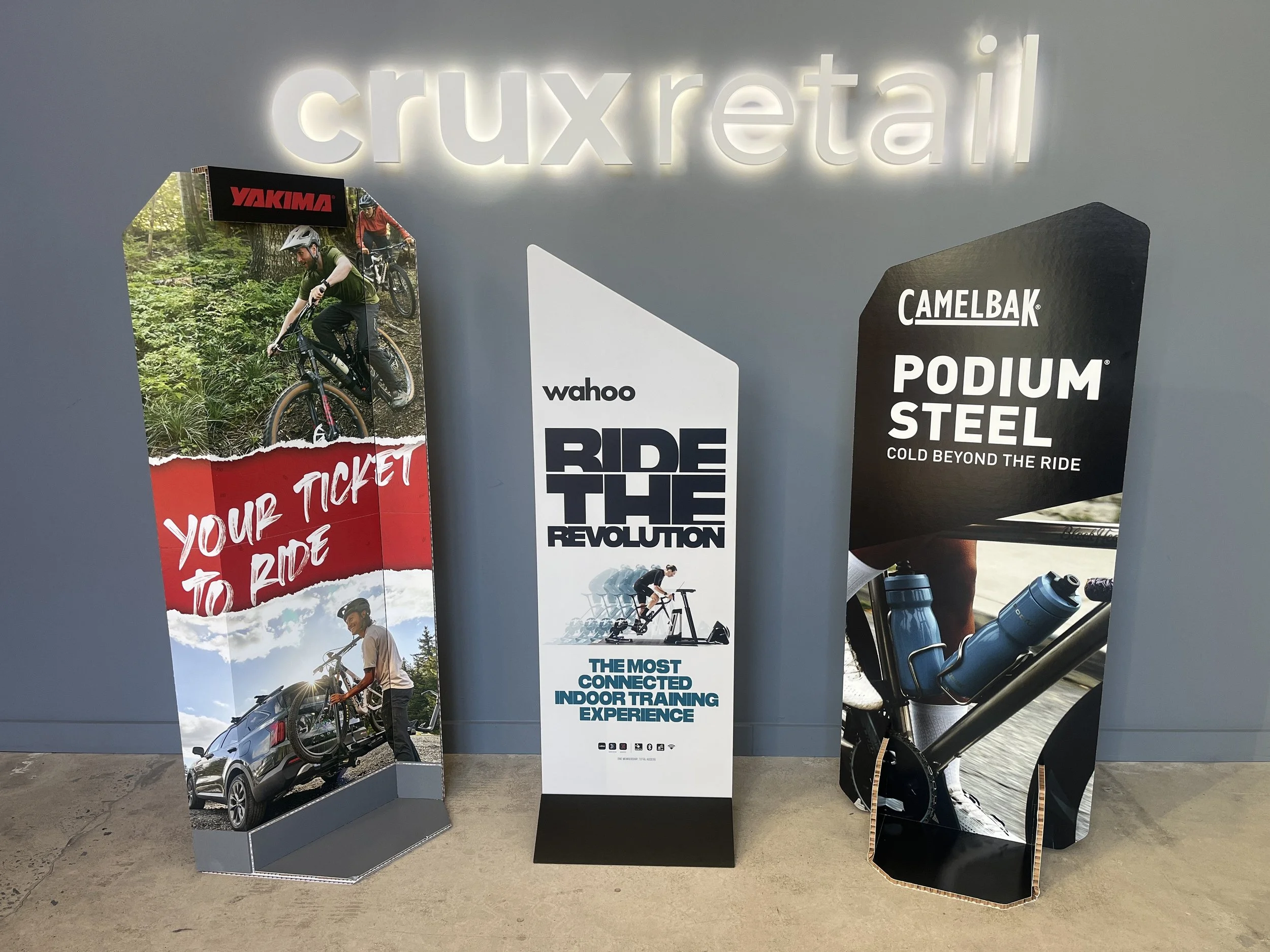 Custom retail display featuring in-house printing examples, including signage, posters, and promotional items designed for retail environments.