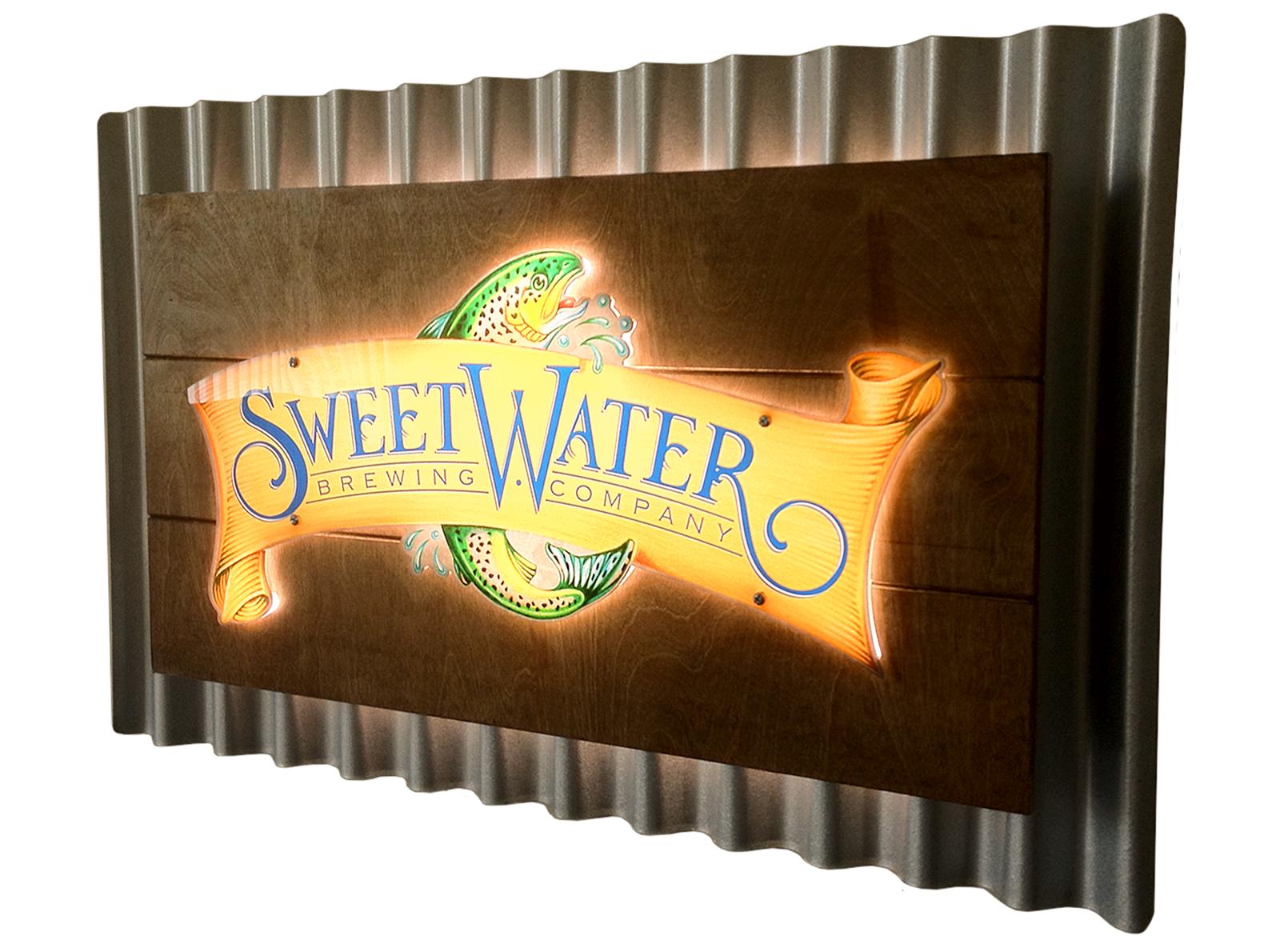 Illuminated sign for SweetWater Brewing Company with a fish jumping out of water, mounted on a wooden panel with metallic framing.