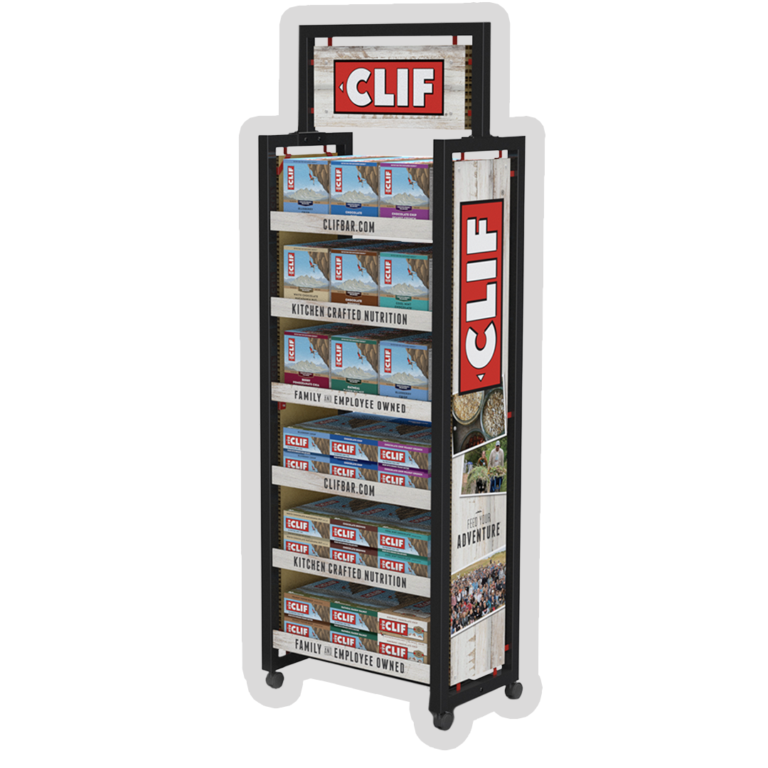 A display stand with shelves holding boxes of Clif Bar energy snacks, decorated with Clif branding and outdoor adventure images.