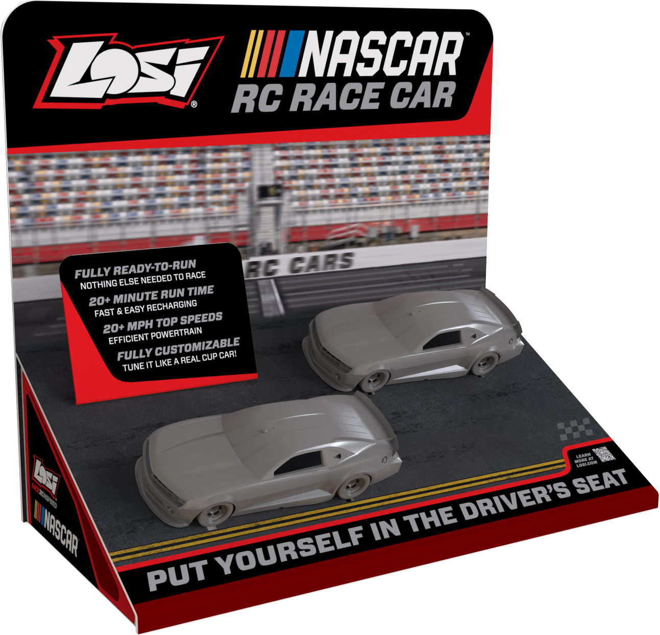 NASCAR RC race car display featuring two silver remote-control stock cars and racing track graphics