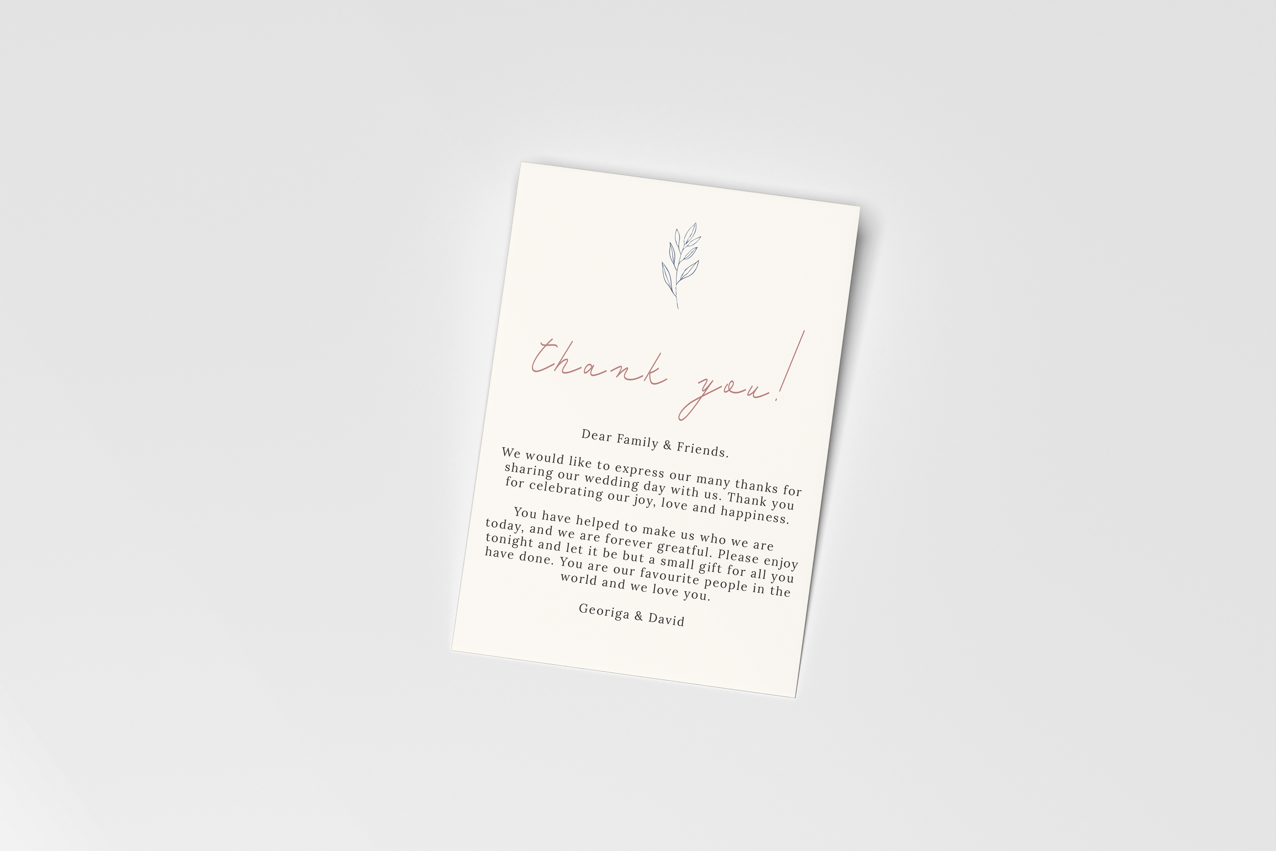 A thank you card with a simple design, featuring a small blue leaf illustration at the top, and text expressing gratitude to family and friends for their support and celebration of a wedding, signed by Georgina and David.