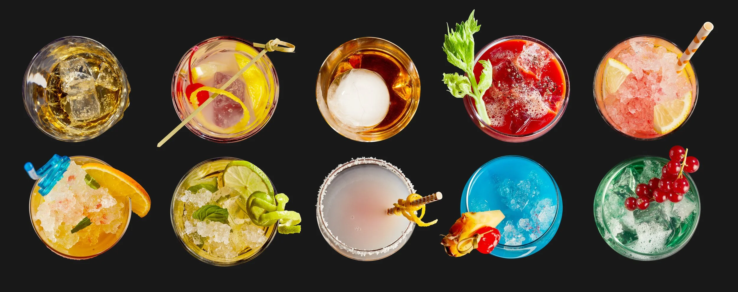 Top view of ten colorful cocktails with various garnishes against a black background.